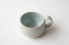 Cappuccino mug in Icy Blue on Speckled Clay