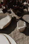 Handmade white speckled ceramic pitcher by Mesh & Cloth