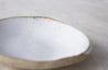 Handmade white speckled ceramic bowl by Mesh & Cloth